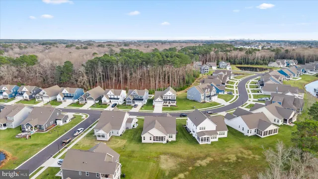 a large kitchen with a table and chairs