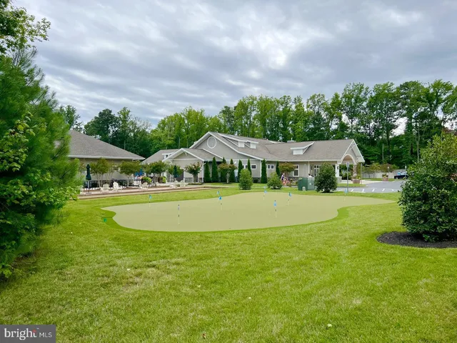 a white table sitting in a kitchen next to a yard