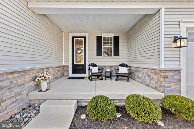 a view of a livingroom with a white walls