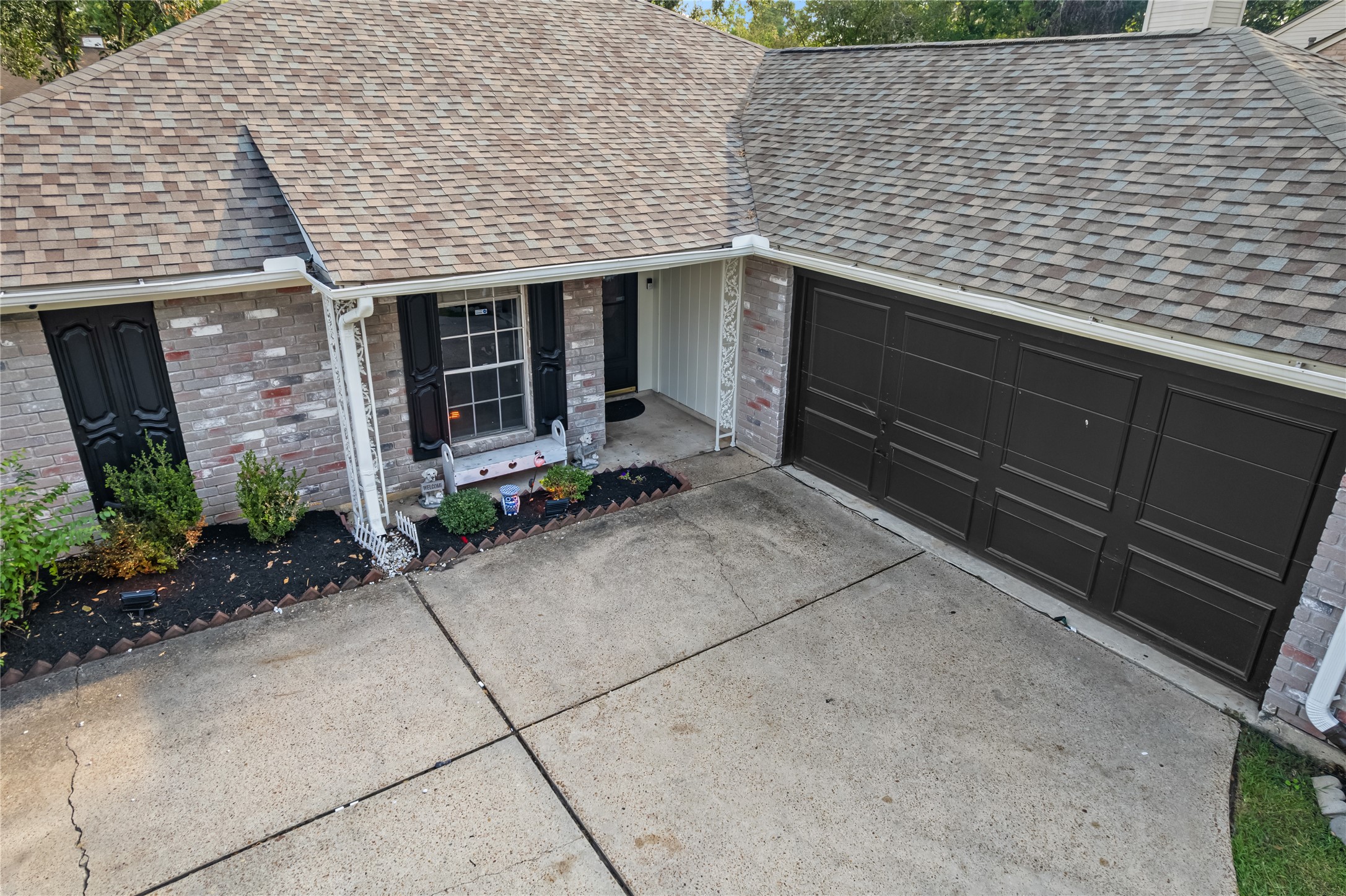 9107 Towerstone Court Spring, TX 77379 - Photo 42 of 42 Charming home with a welcoming front entrance, featuring a two-car garage and well-maintained landscaping.