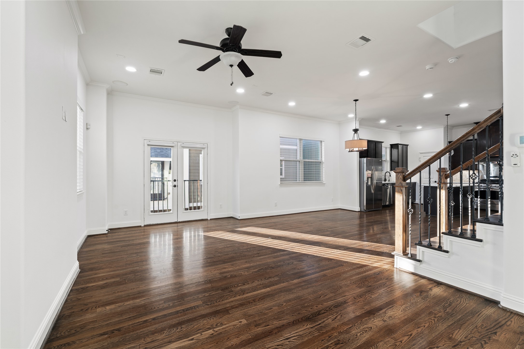 933 West 24th Street, Unit A Houston, TX 77008 - Photo 23 of 41 a view of a livingroom with wooden floor and stairs