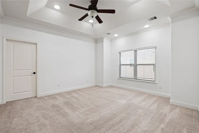 a view of a livingroom with wooden floor and stairs