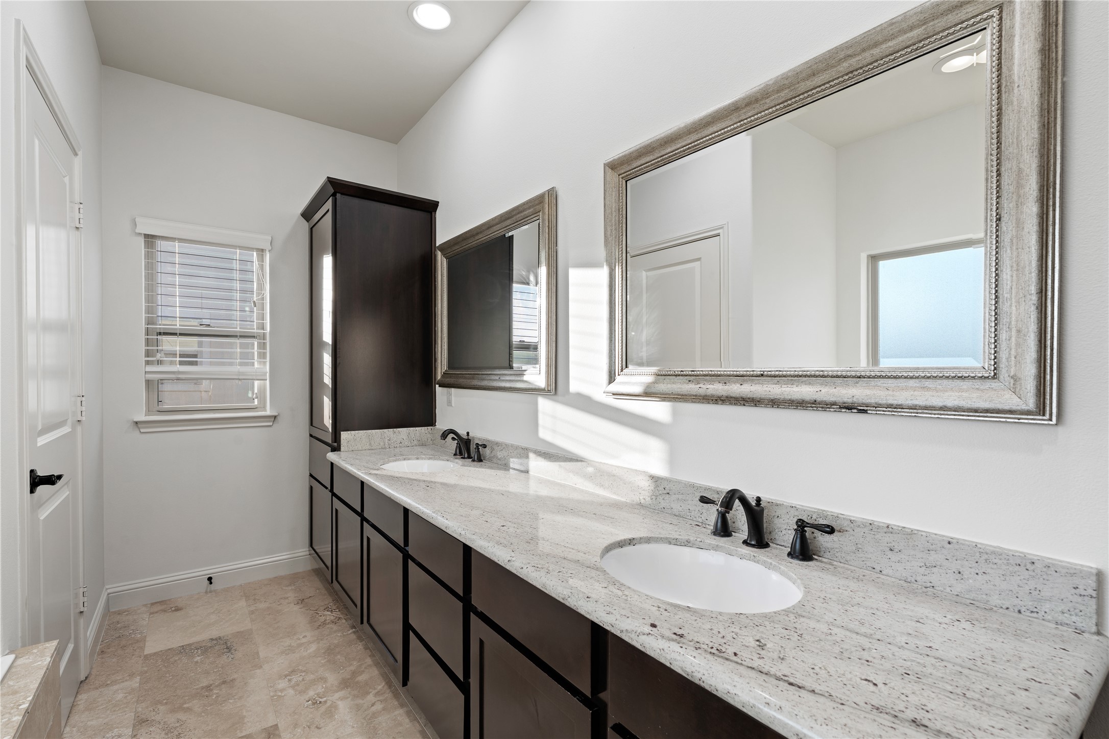933 West 24th Street, Unit A Houston, TX 77008 - Photo 28 of 41 a bathroom with a granite countertop sink and a mirror