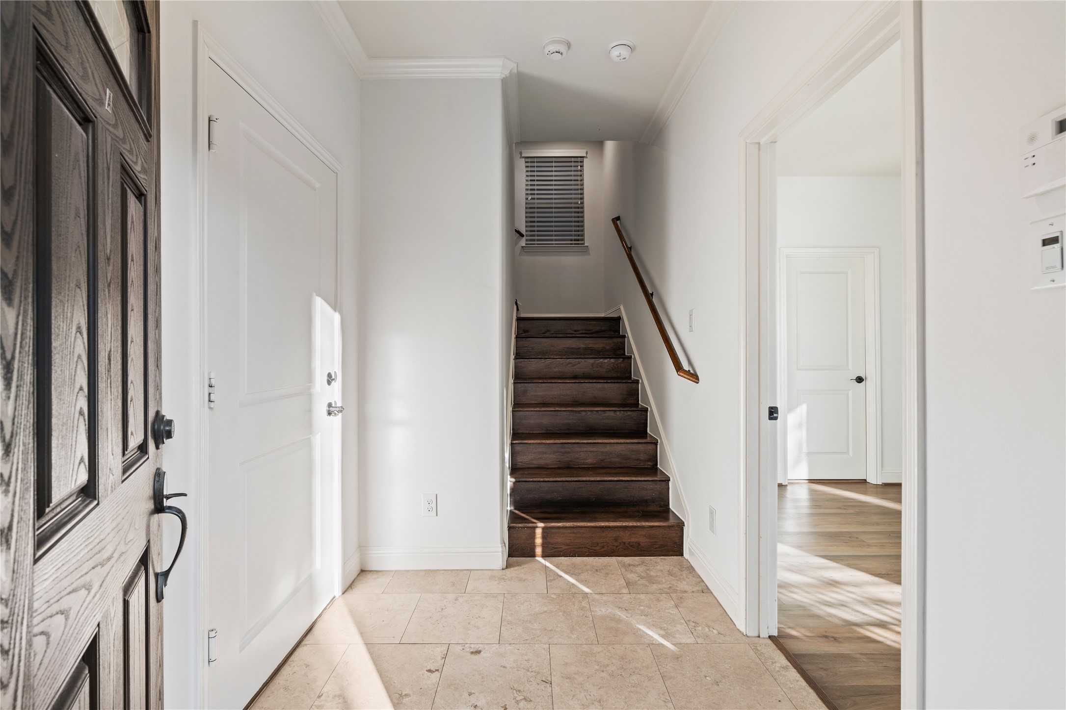 933 West 24th Street, Unit A Houston, TX 77008 - Photo 2 of 41 a view of entryway with wooden floor and stairs