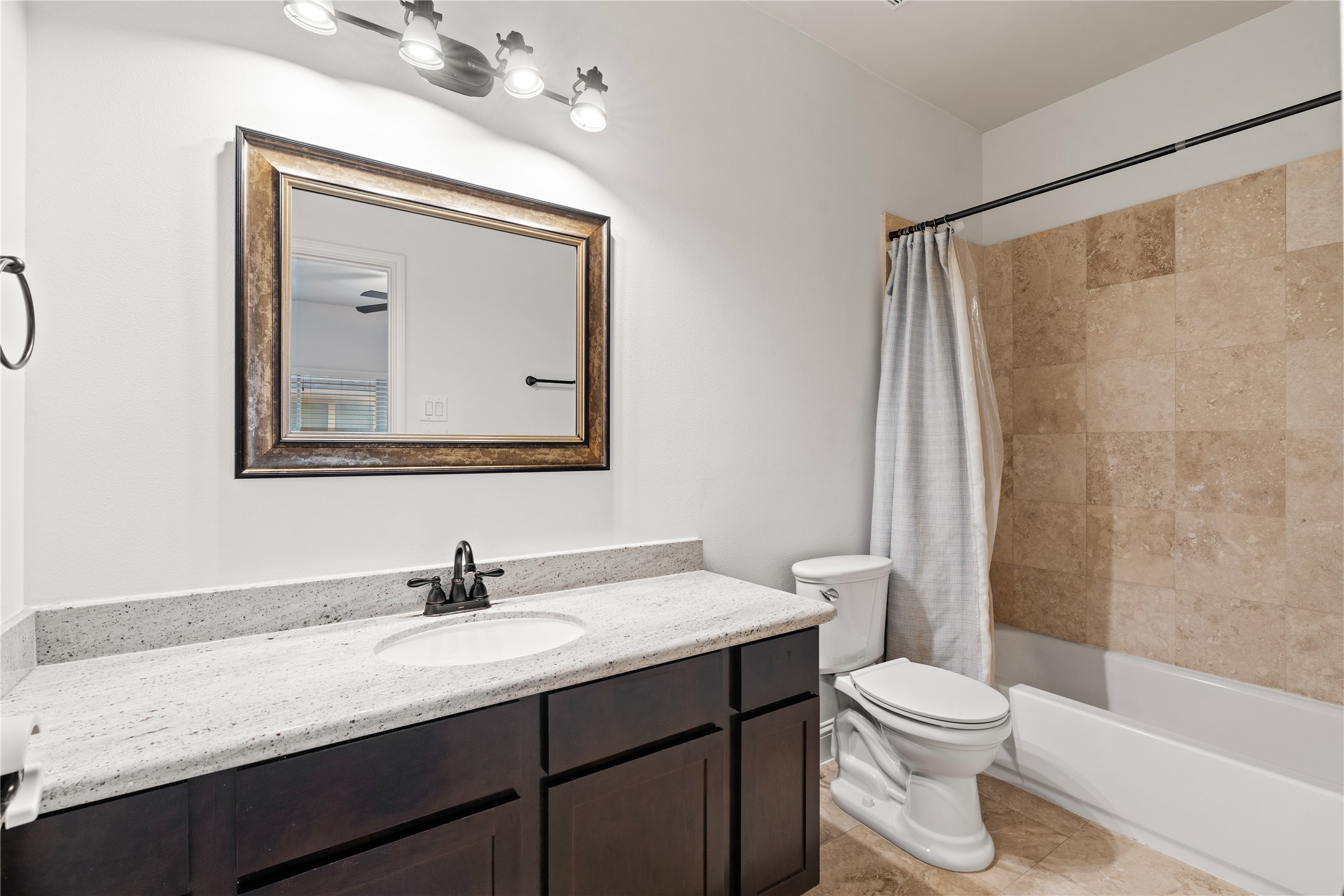 933 West 24th Street, Unit A Houston, TX 77008 - Photo 32 of 41 a bathroom with a granite countertop sink toilet and shower