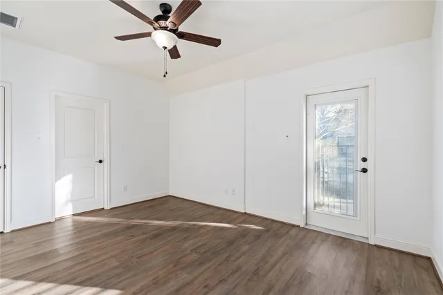 a view of entryway with wooden floor and stairs
