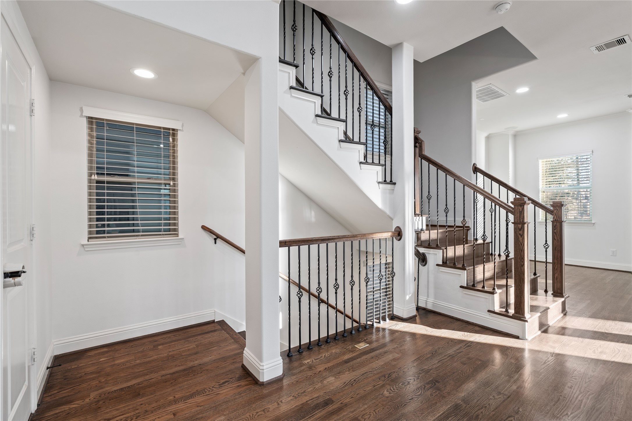 933 West 24th Street, Unit A Houston, TX 77008 - Photo 6 of 41 a view of staircase with wooden floor and white walls