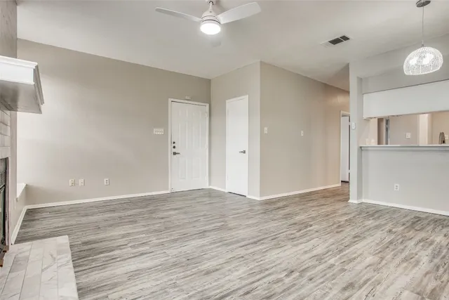 a view of a kitchen with wooden floor