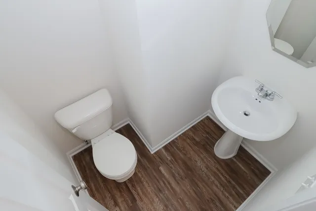 a bathroom with a toilet and sink