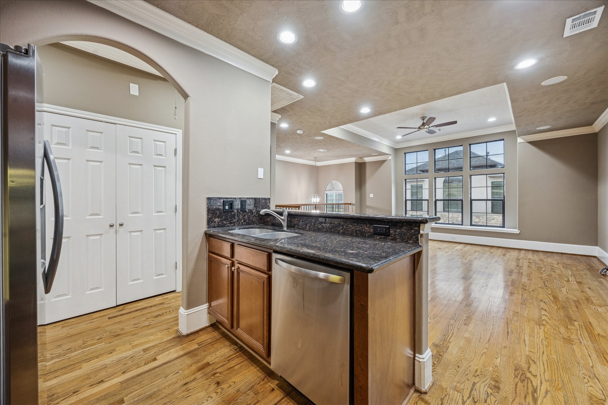 1376 Studer Street Houston, TX 77007 - Photo 13 of 38 a kitchen with stainless steel appliances granite countertop a stove and a sink