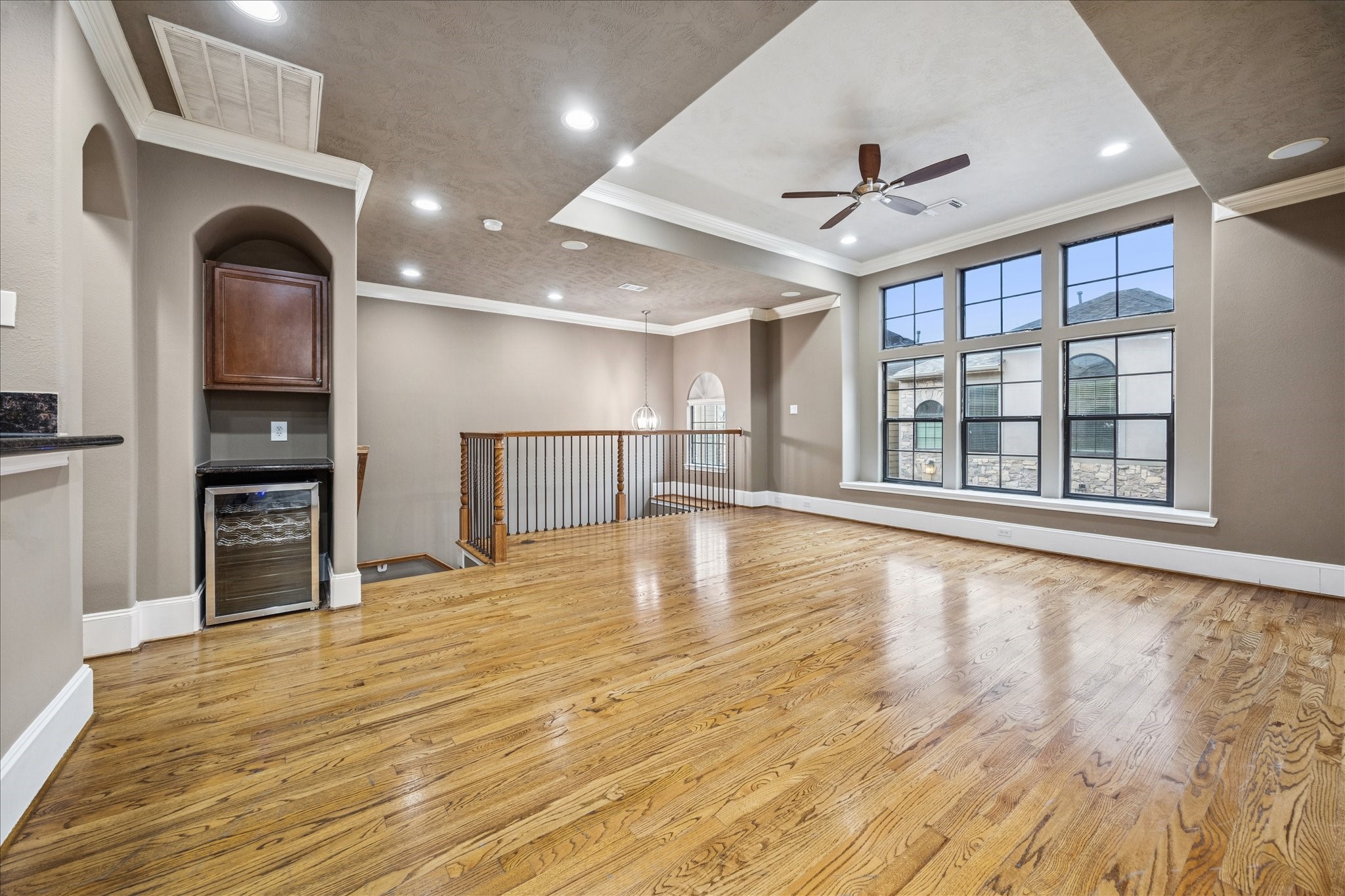 1376 Studer Street Houston, TX 77007 - Photo 9 of 38 a view of empty room with wooden floor and fan