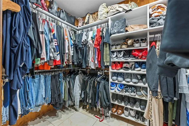 a view of a hallway with furniture and staircase