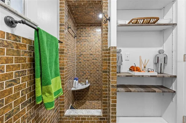 a view of a kitchen with kitchen island dining table and chairs