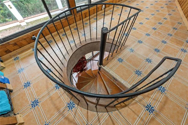 a bed room with a bed window and a table