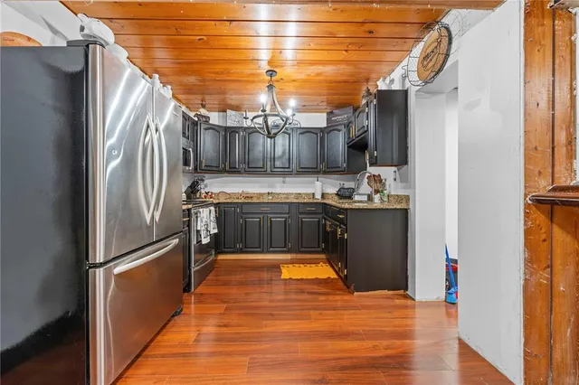 a work room with furniture and a book shelf