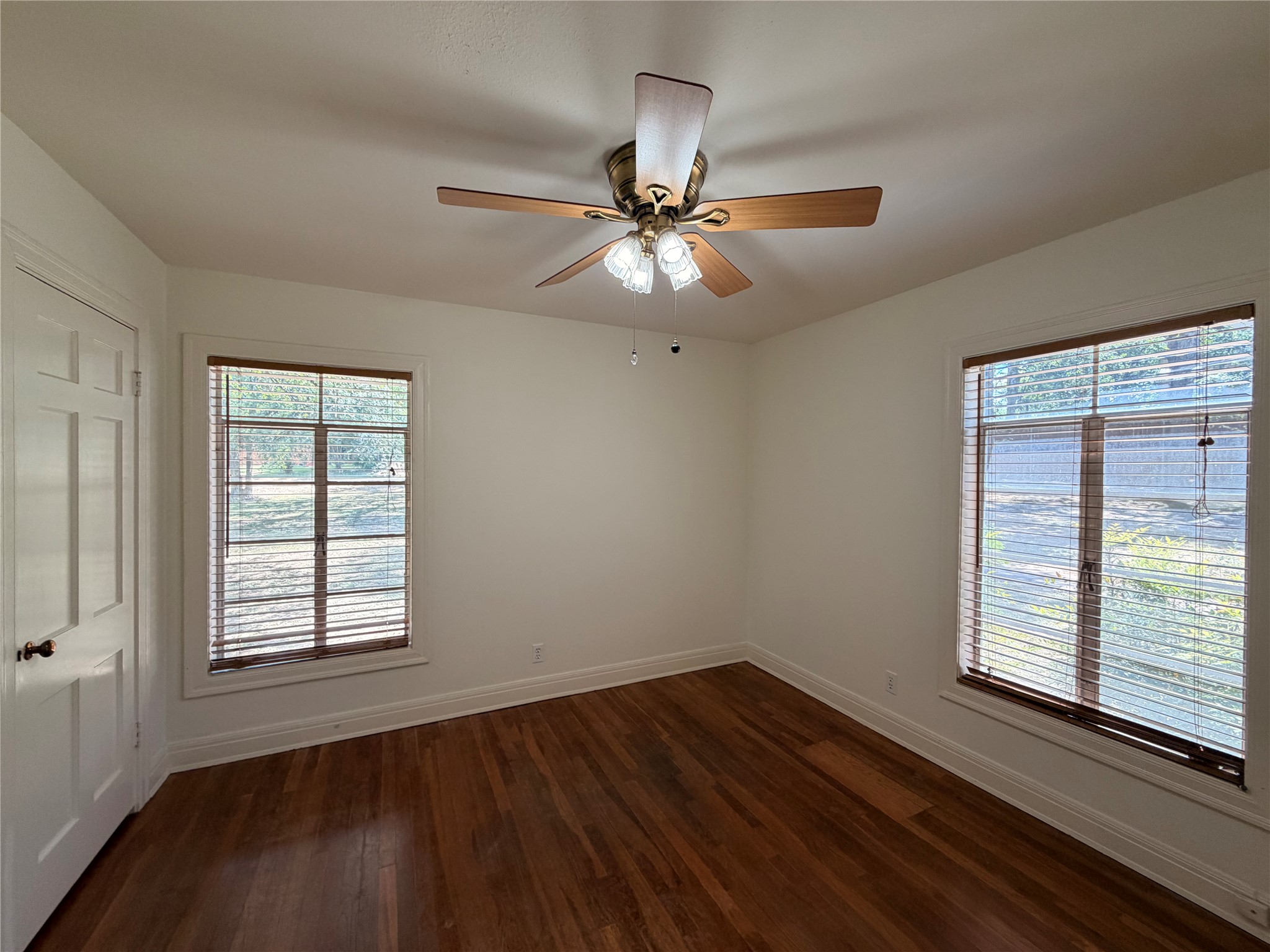 2511 Enfield Road, Unit A Austin, TX 78703 - Photo 5 of 7 Rich hardwood flooring and abundant natural light define this cozy and comfortable bedroom.