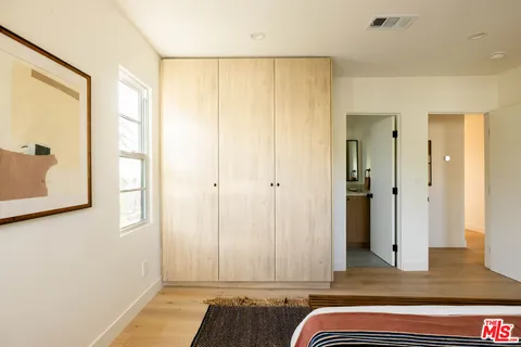 a view of room with window and a bathroom
