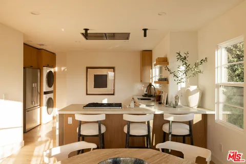 a room with a table chairs and projector room