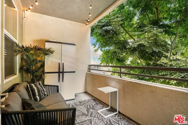 a view of balcony with furniture