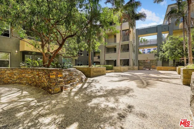 a view of a building with a yard