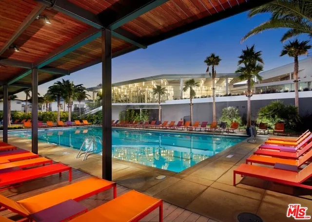 a view of a backyard with a deck and a patio