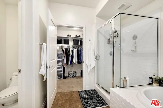 a bathroom with a bathtub and a shower