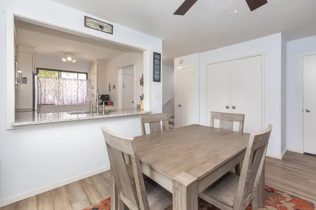 a dining room with a table and chairs