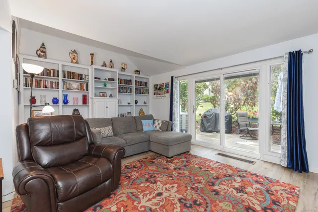 a living room with furniture and a rug