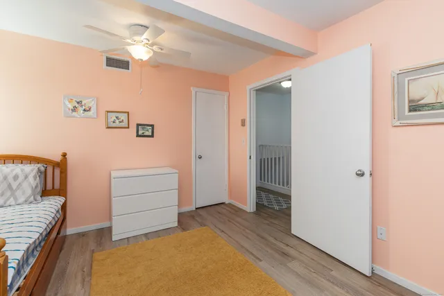 a view of livingroom with hardwood floor and cabinet