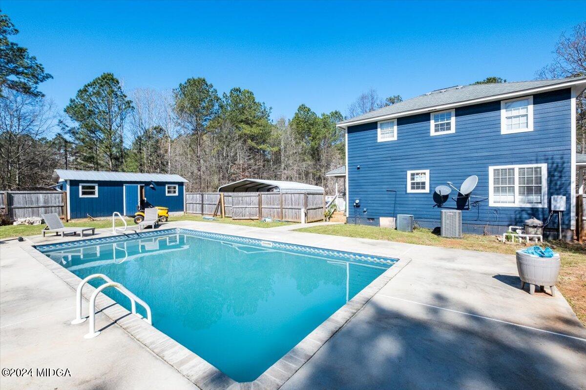 507 Edge Road Forsyth, GA 31029 - Photo 24 of 26 a view of a house with swimming pool