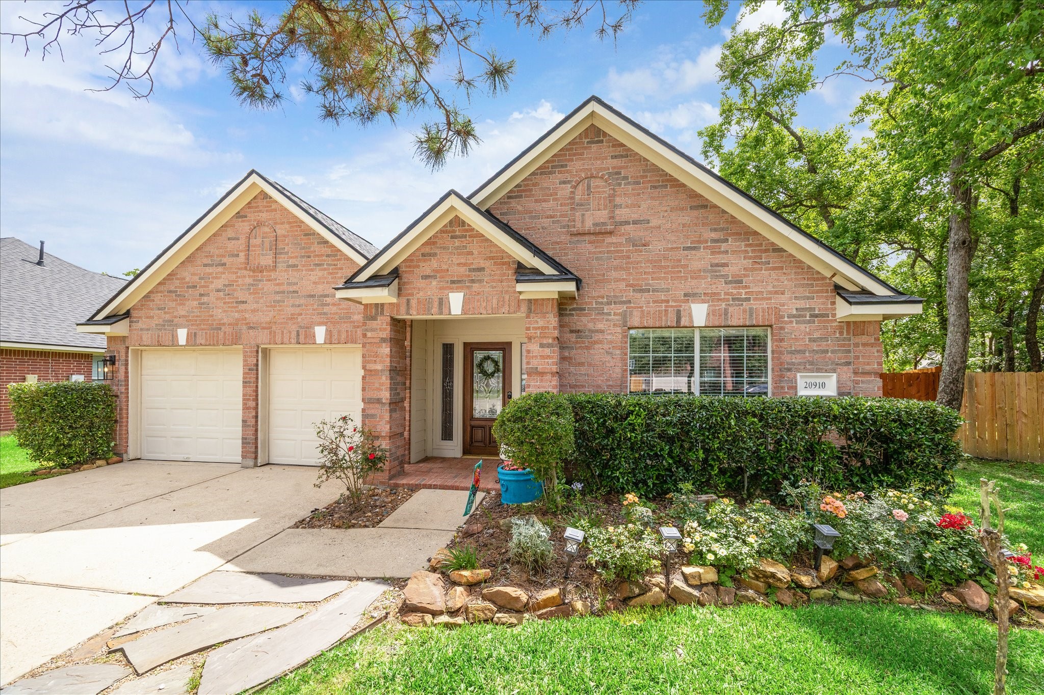 20910 Sandy Briar Court Spring, TX 77379 - Photo 2 of 28 a front view of a house with a yard and porch