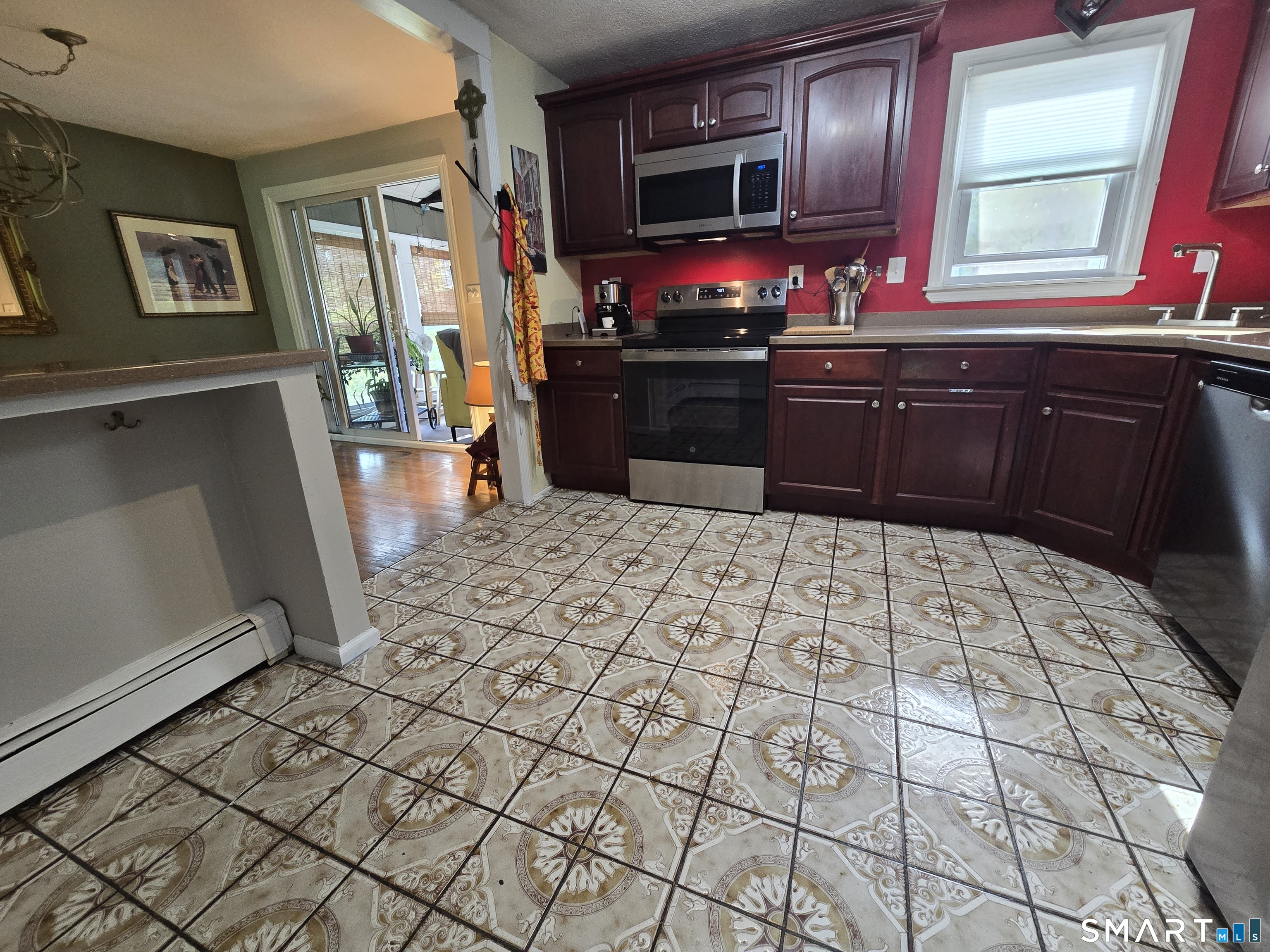 1004 Hickory Hill Road Thomaston, CT 06787 - Photo 10 of 23 a kitchen with stainless steel appliances a sink and a refrigerator