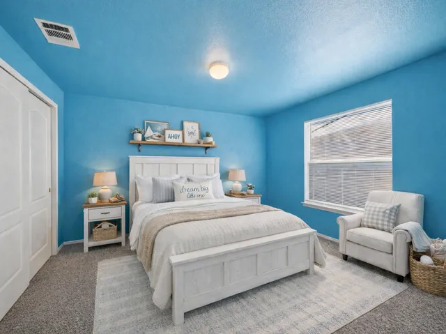 a bedroom with a bed and a couch