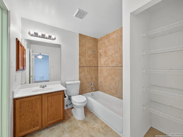 a bathroom with a toilet a sink and bathtub