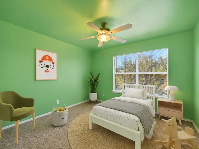 a bedroom with a bed and a chair