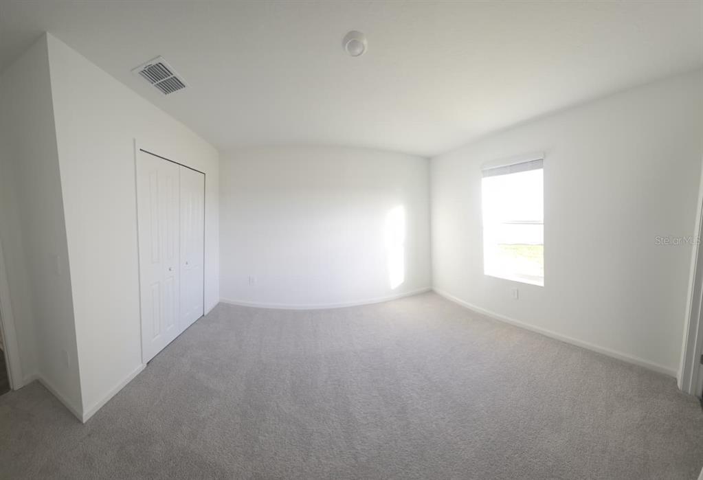 8325 Southwest 42nd Circle Ocala, FL 34476 - Photo 11 of 23 an empty room with windows and closet