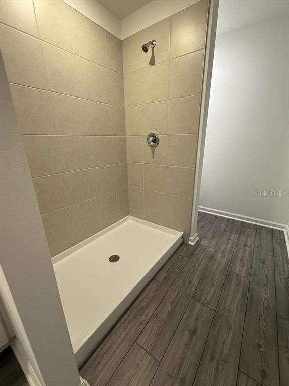 8325 Southwest 42nd Circle Ocala, FL 34476 - Photo 15 of 23 a bathroom with a tub and shower