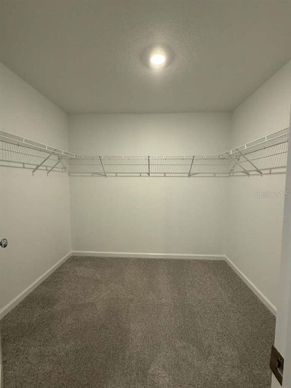 8325 Southwest 42nd Circle Ocala, FL 34476 - Photo 20 of 23 a view of a room with racks on the wall