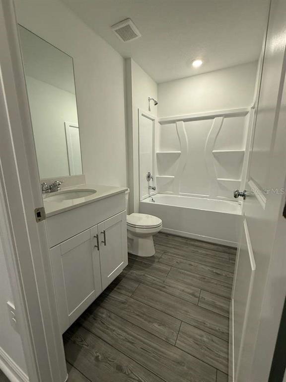 8325 Southwest 42nd Circle Ocala, FL 34476 - Photo 21 of 23 a bathroom with a sink a toilet and shower