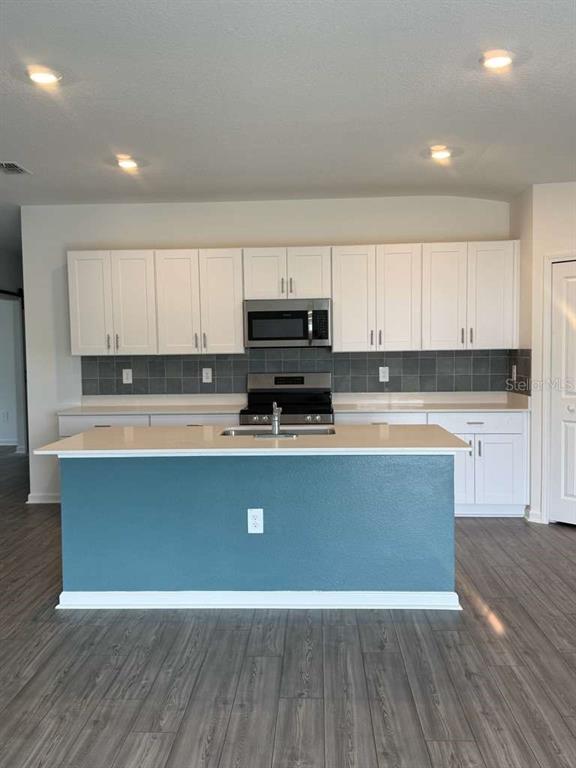8325 Southwest 42nd Circle Ocala, FL 34476 - Photo 3 of 23 a view of kitchen with wooden floor