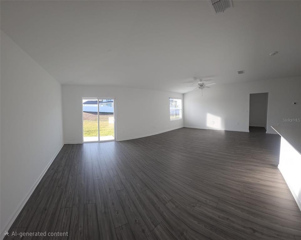 8325 Southwest 42nd Circle Ocala, FL 34476 - Photo 6 of 23 a view of empty room with window and wooden floor