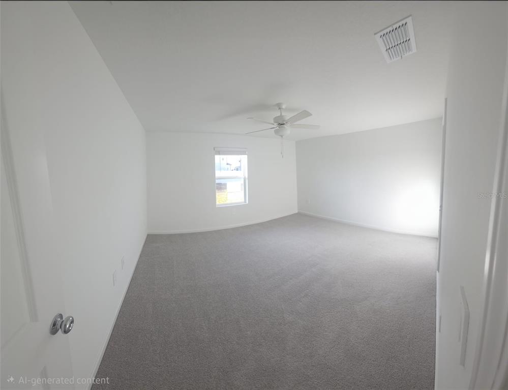8325 Southwest 42nd Circle Ocala, FL 34476 - Photo 7 of 23 an empty room with windows and chandelier fan