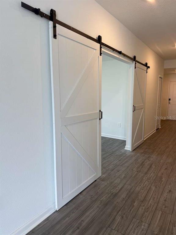 8325 Southwest 42nd Circle Ocala, FL 34476 - Photo 9 of 23 a view of walk in closet with wooden floor