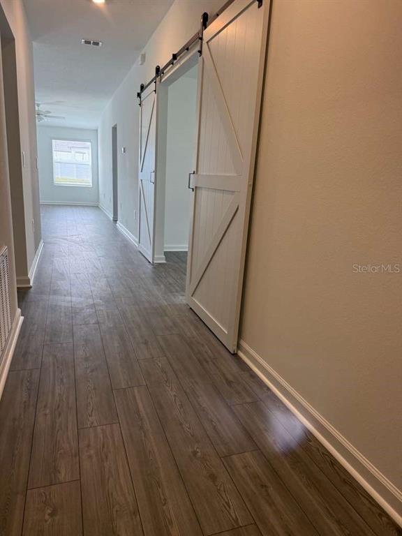 8325 Southwest 42nd Circle Ocala, FL 34476 - Photo 10 of 23 a view of hallway with stairs and wooden floor