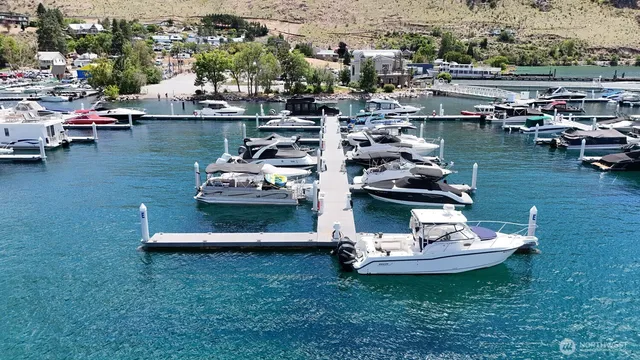 a view of a lake with boats and trees