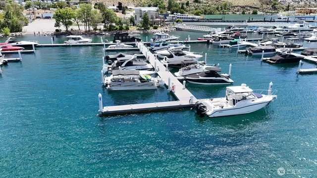 an aerial view of a house with a lake view