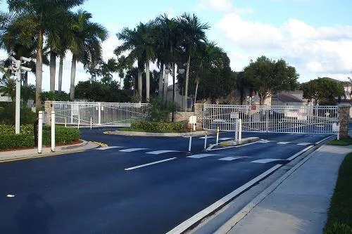 a view of a street with palm trees