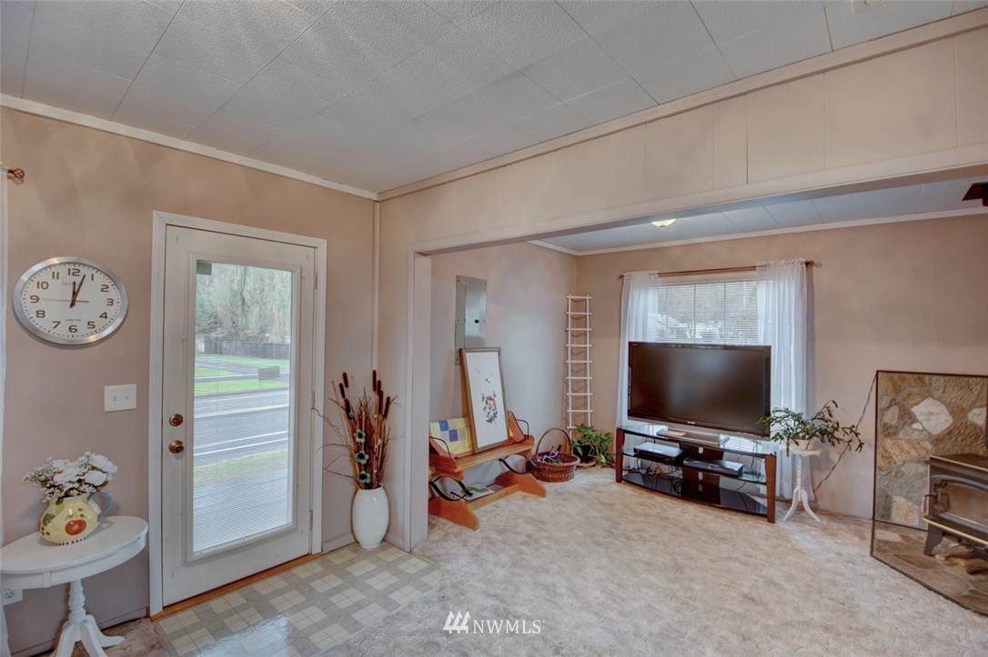238 Stowell Road Salkum, WA 98582 - Photo 3 of 26 a view of a livingroom with furniture and a flat screen tv