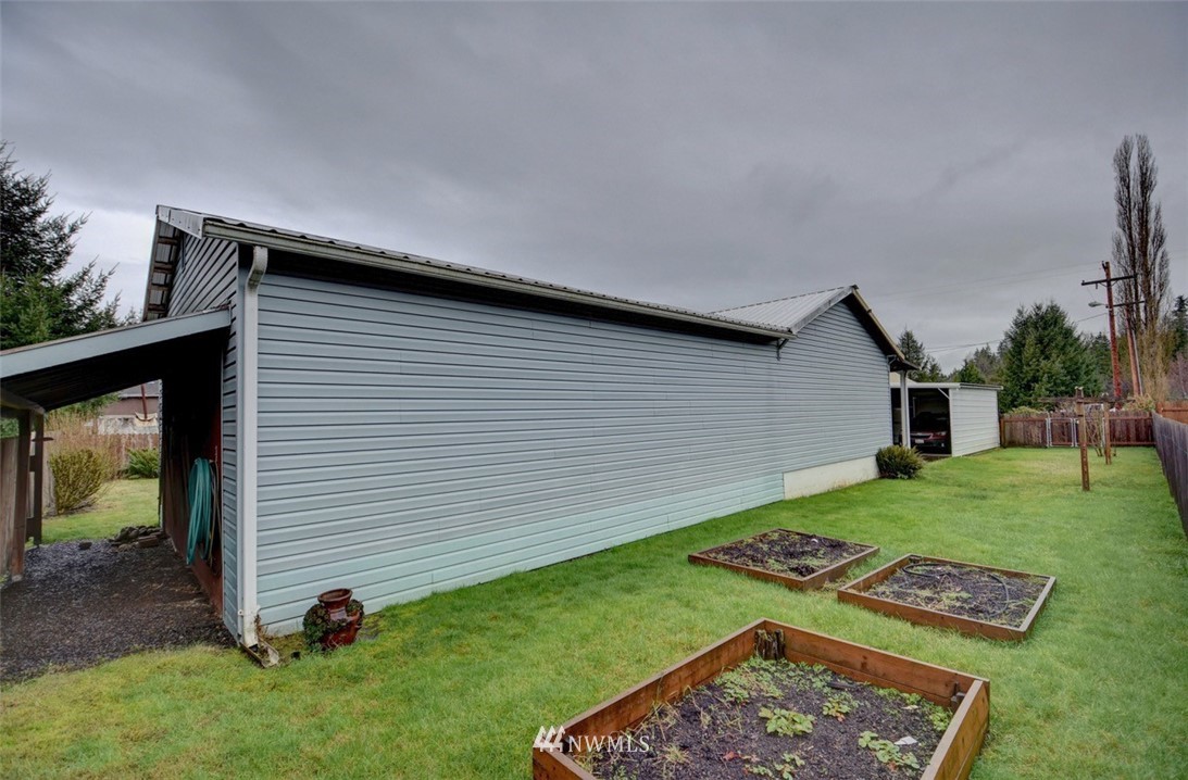 238 Stowell Road Salkum, WA 98582 - Photo 23 of 26 a backyard of a house with barbeque oven table and chairs