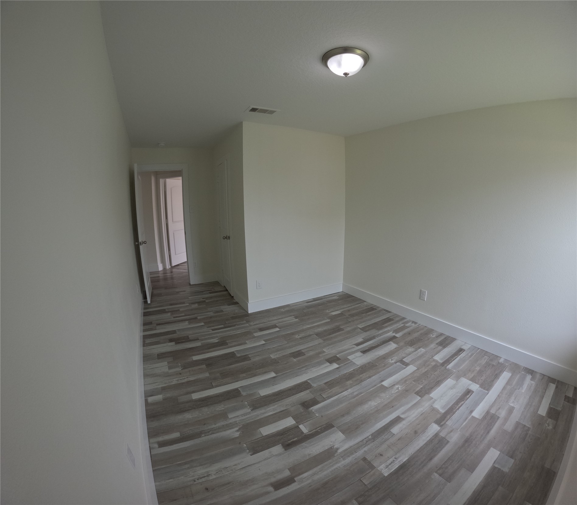 8419 Hannah Rd Cove Cove, TX 77523 - Photo 19 of 28 a view of empty room with wooden floor